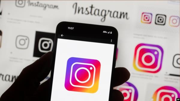 FILE - The Instagram logo is seen on a cellphone in Boston, Oct. 14, 2022.